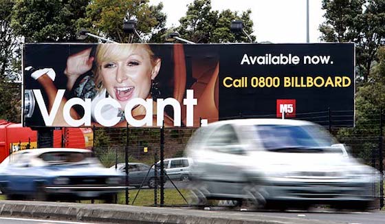 trees blocking billboard